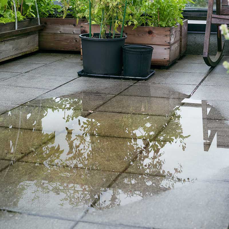 Pooling of water on concrete patio blocks